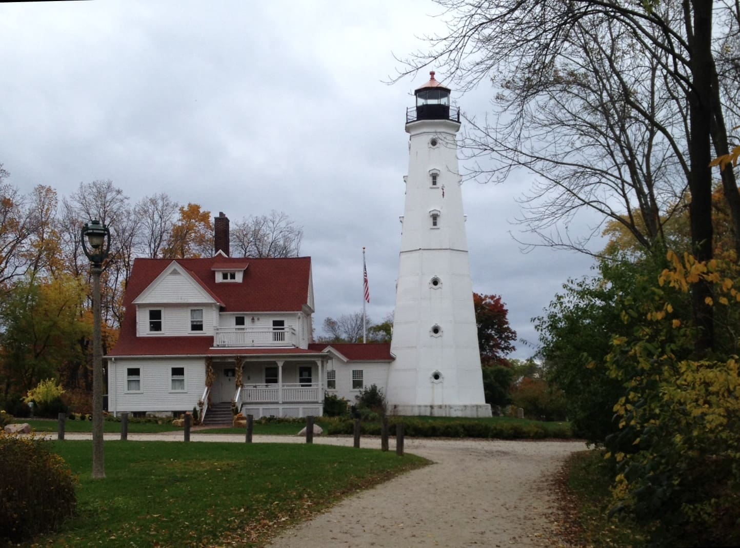lighthouse with a cloudy sky in the background