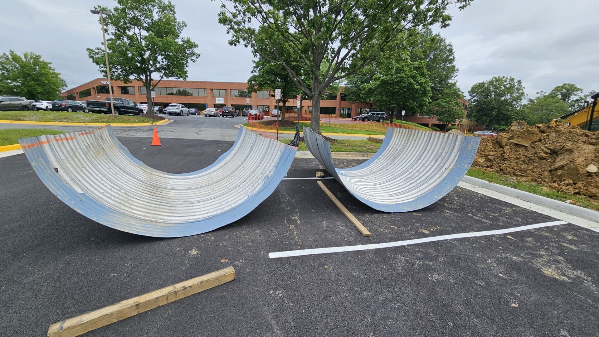 cut pipes laying in a parking lot