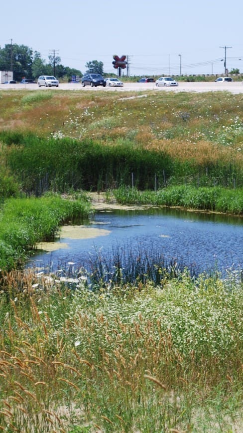 retention pond on the side of the road
